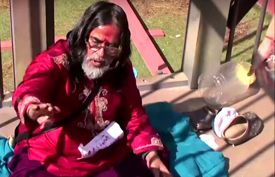 Swami Om sprinkle his blood