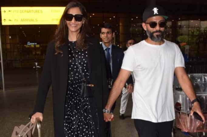 Sonam Kapoor Ahuja and Anand Ahuja are all smiles at the airport; check out their stylish looks  