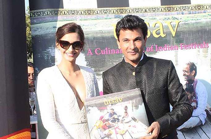 Sonam unveils Vikas Khanna's book at Cannes 