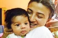 Suhasi Goradia Dhami with her child