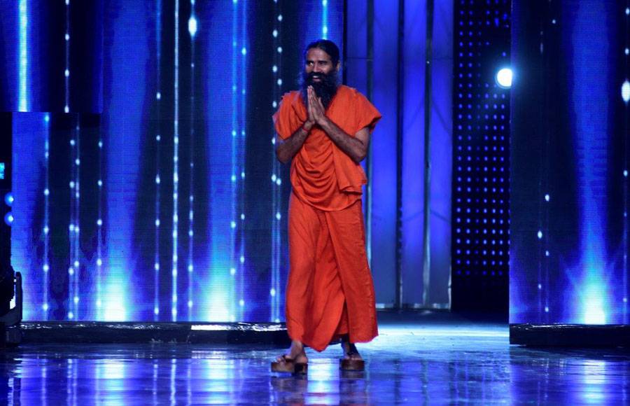 Baba Ramdev performing Yoga with Brent on the sets of Nach Baliye 8